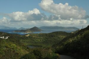 a scenic view of the ocean and mountains