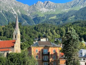 a view of a town with mountains in the background